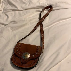 Super cool, small shoulder bag. Lots of silver!